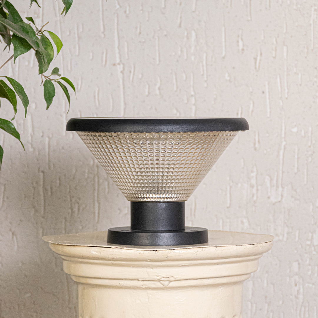 Modern black solar outdoor gate light with glowing textured panels for stylish exterior decor use.