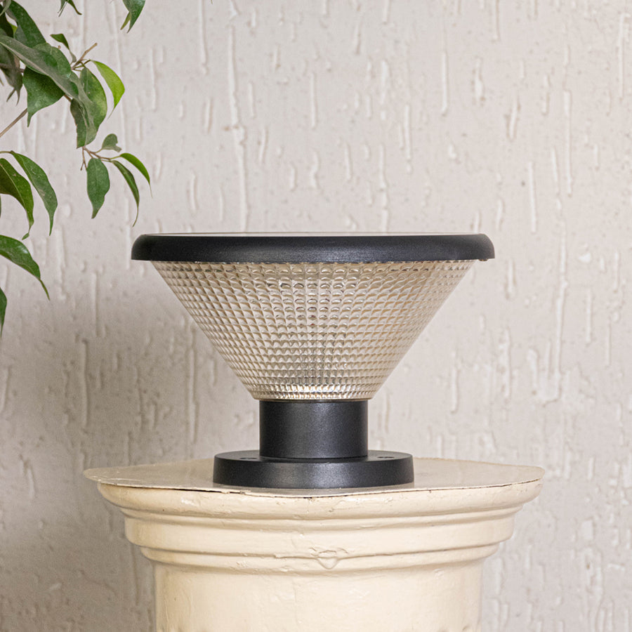 Modern black solar outdoor gate light with glowing textured panels for stylish exterior decor use.