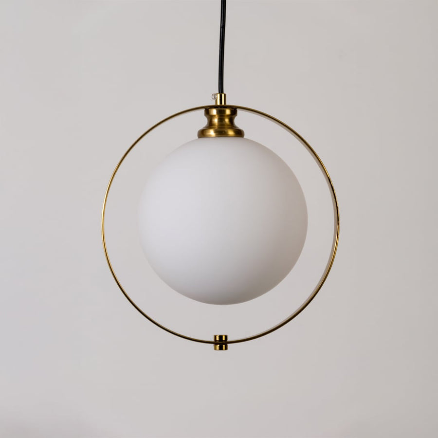 Closeup view of the pendant light highlighting the frosted globe gold ring frame and fine detailing for a modern elegant finish.