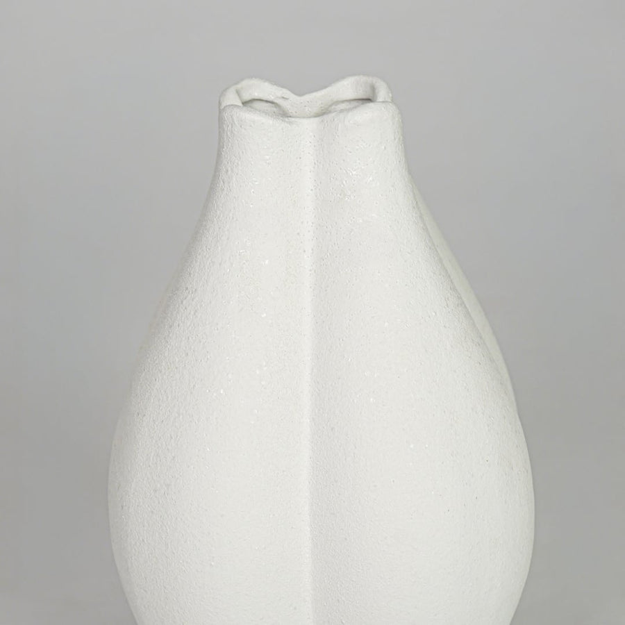 Closeup white smooth ceramic vase texture detail modern decorative flower vase for table shelf console decor.