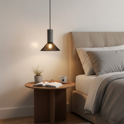 Smoky glass pendant light beside the bed creating warm ambiance with contemporary elegance indoors.