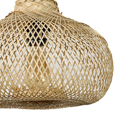 Large rattan pendant light with organic rounded shape and airy woven texture suspended against minimal neutral wall background for modern boho interiors.

