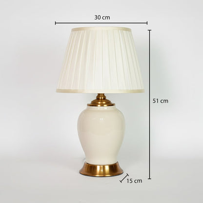 Ivory ceramic table lamp showing 51 cm height 30 cm shade width and 15 cm base size ideal for bedside placement.