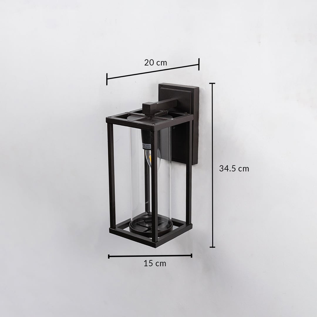 Outdoor wall light with black frame and clear glass shade shown with 34.5 cm height 20 cm width and 15 cm depth.