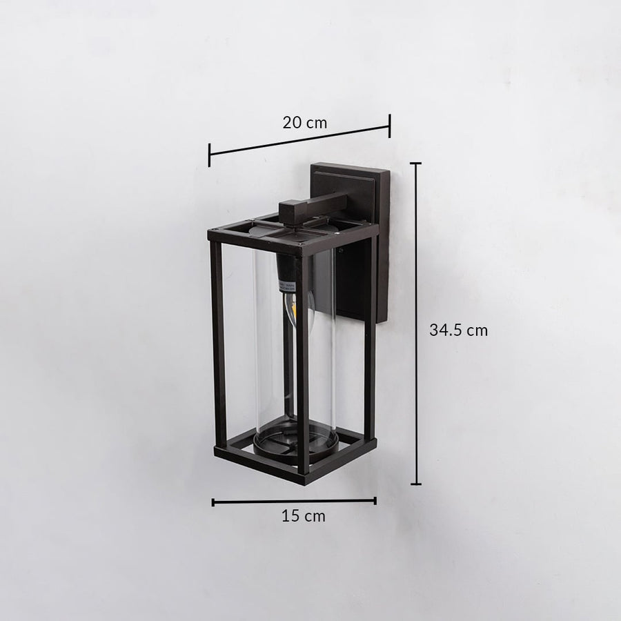 Outdoor wall light with black frame and clear glass shade shown with 34.5 cm height 20 cm width and 15 cm depth.