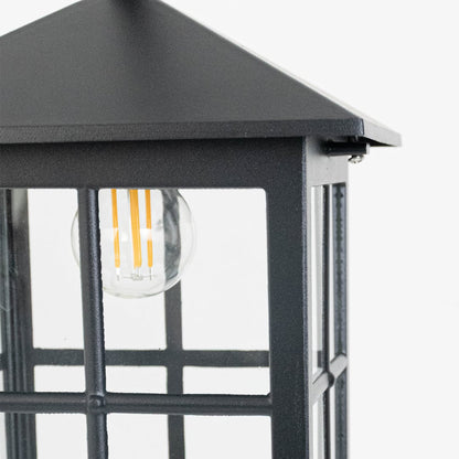 Detailed view of black lantern light highlighting pyramid top and clear glass sides.