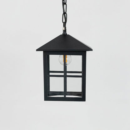 Black hanging lantern light turned off on white background showing clean lines and classic finish.