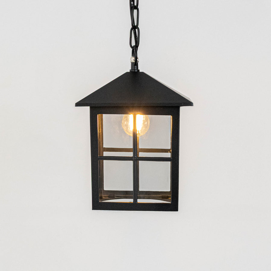 Elegant black metal box hanging lantern light with clear glass panels for modern outdoor lighting decor.