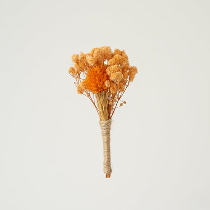 Bright dried flower bouquet with warm orange tones and natural texture ideal for home decor vase styling.