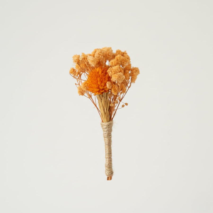 Bright dried flower bouquet with warm orange tones and natural texture ideal for home decor vase styling.