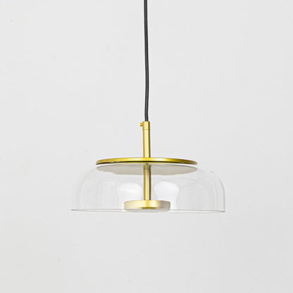 Minimalist clear glass and brass metal pendant light for refined modern home decor spaces.