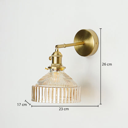 Gold metal wall light with ribbed glass shade sized 26 cm height 23 cm width and 17 cm depth ideal for wall decor installation.