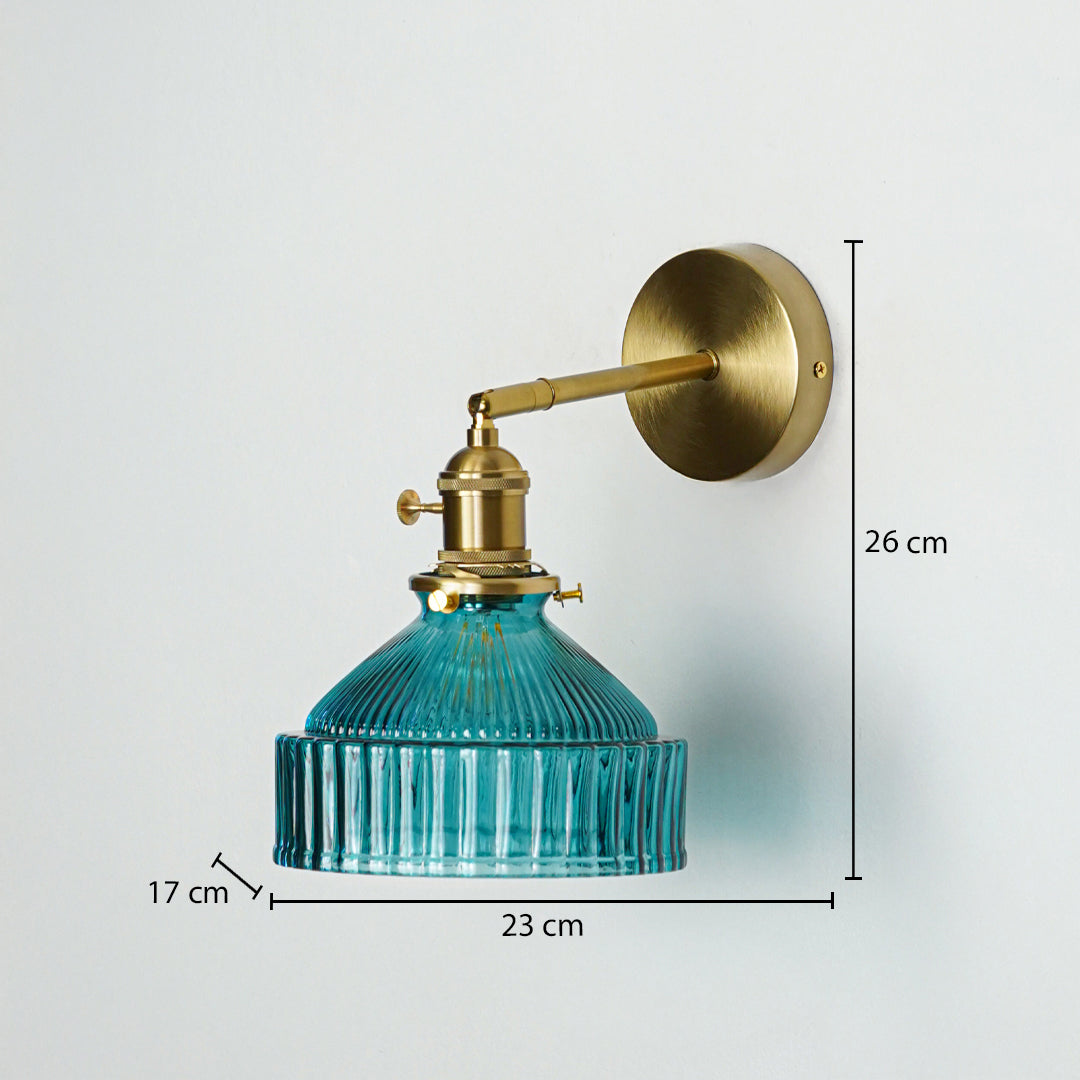 Gold metal wall light with blue ribbed glass shade sized 26 cm height 23 cm width and 17 cm depth ideal for wall decor placement.