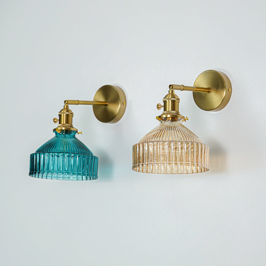 Set of gold metal wall lights with blue and clear ribbed glass shades perfect for modern bedroom or hallway wall decor.