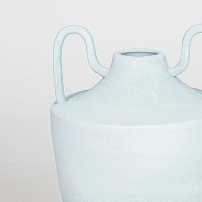 Closeup light blue textured ceramic vase surface detail modern decorative flower vase for table shelf console decor.
