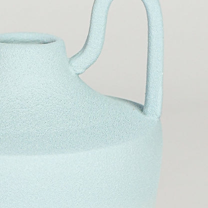 Close view of pastel blue ceramic vase highlighting soft gradient finish sculpted neck and symmetrical handles.