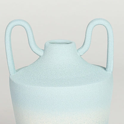 Table lamp style ceramic vase with soft textured finish and sculpted rim detail shown in close up highlighting its organic shape and subtle tonal variation