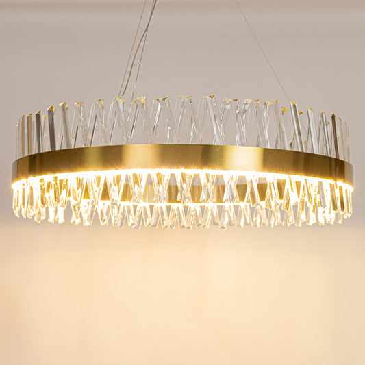 Gold metal chandelier with crystal rods displayed with lights on highlighting its clean round silhouette and premium glass texture.