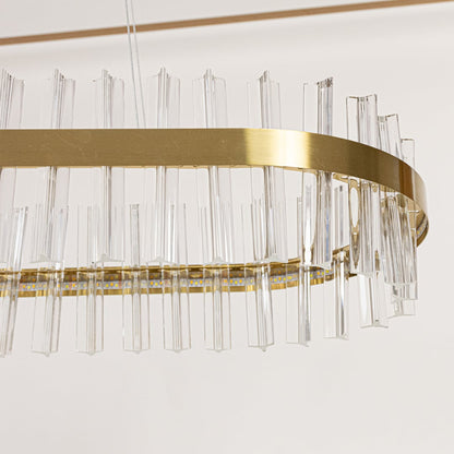 Closeup of gold metal chandelier highlighting the clear crystal rod detailing and elegant metallic frame crafted for luxurious modern lighting.