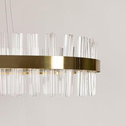 Closeup shot of gold metal chandelier focusing on its crystal textures and warm illumination for refined and elegant interior lighting.