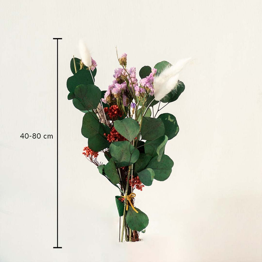 Preserved dried flower bouquet featuring eucalyptus leaves berries and florals tied neatly for refined decor styling.