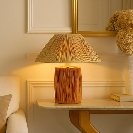 Beautiful table lamp featuring a rattan-style base and shade enhances cozy living spaces with organic style and artisanal charm.