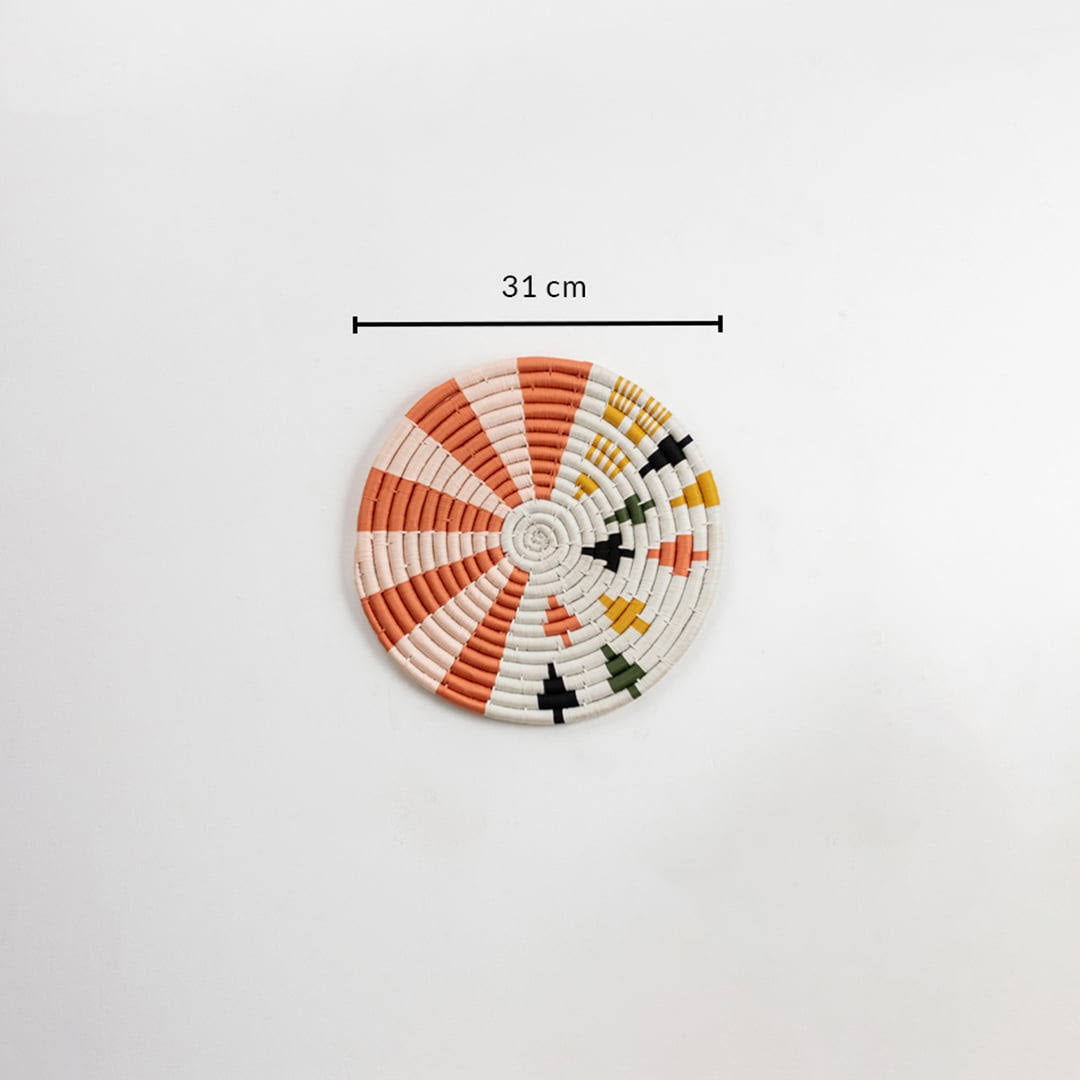 Dimension image of handcrafted seagrass wall basket with coral orange cream and black pattern for boho wall décor display.