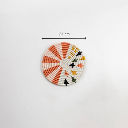 Dimension image of handcrafted seagrass wall basket with coral orange cream and black pattern for boho wall décor display.
