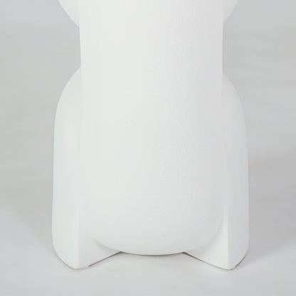 Closeup image of white ceramic modern vase for elegant shelf placement with artistic matte finish styling display.