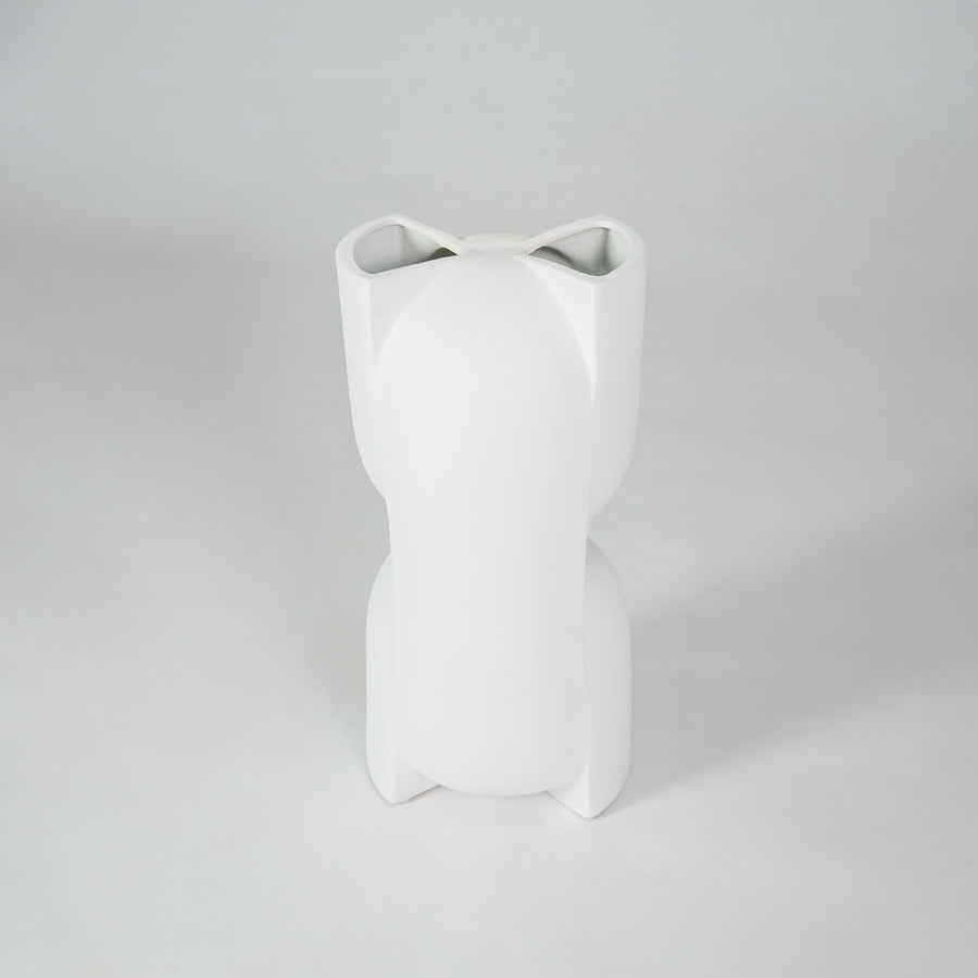 White ceramic vase for minimalist coffee table placement and modern living room decor styling accent piece.