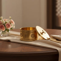 Gold metal decorative storage box lifestyle image with floral accents for elegant luxury dining table decor.
