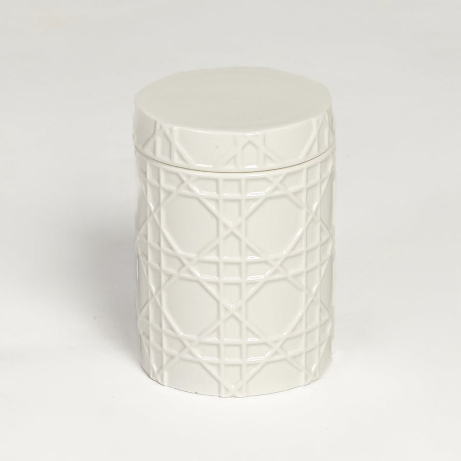 White ceramic decorative jar with embossed geometric pattern isolated on clean white background for elegant tabletop decor display.