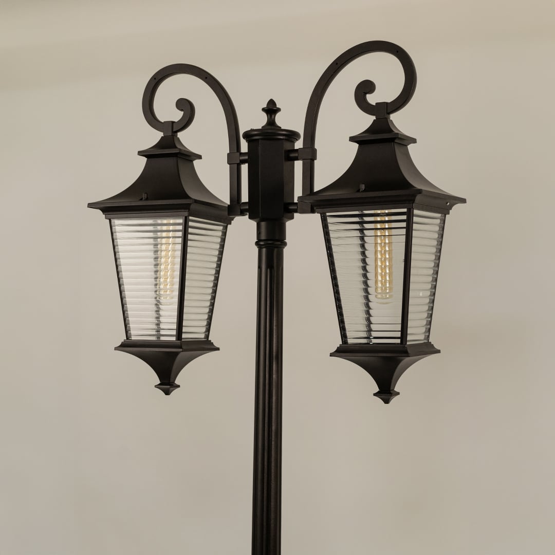 Closeup of vintage outdoor street lamp with dual ribbed lantern shades for luxury exterior decor use.