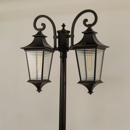 Closeup of vintage outdoor street lamp with dual ribbed lantern shades for luxury exterior decor use.