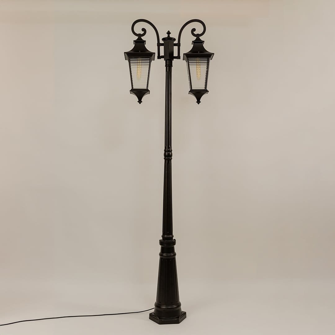 Vintage outdoor street lamp with dual lantern shades for elegant exterior decor styling use.