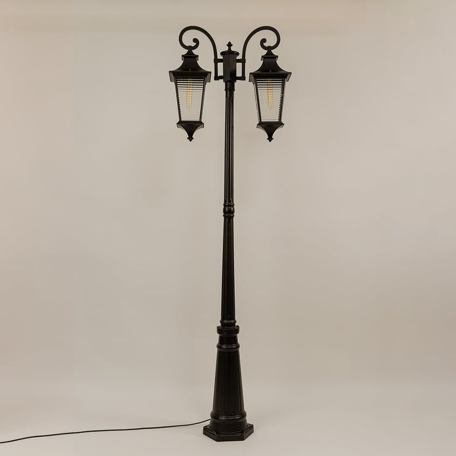 Vintage outdoor street lamp with dual lantern shades for elegant exterior decor styling use.
