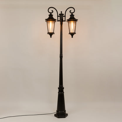 Black outdoor street lamp with dual lantern shades for elegant exterior decor styling use.
