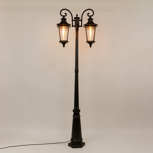 Black outdoor street lamp with dual lantern shades for elegant exterior decor styling use.
