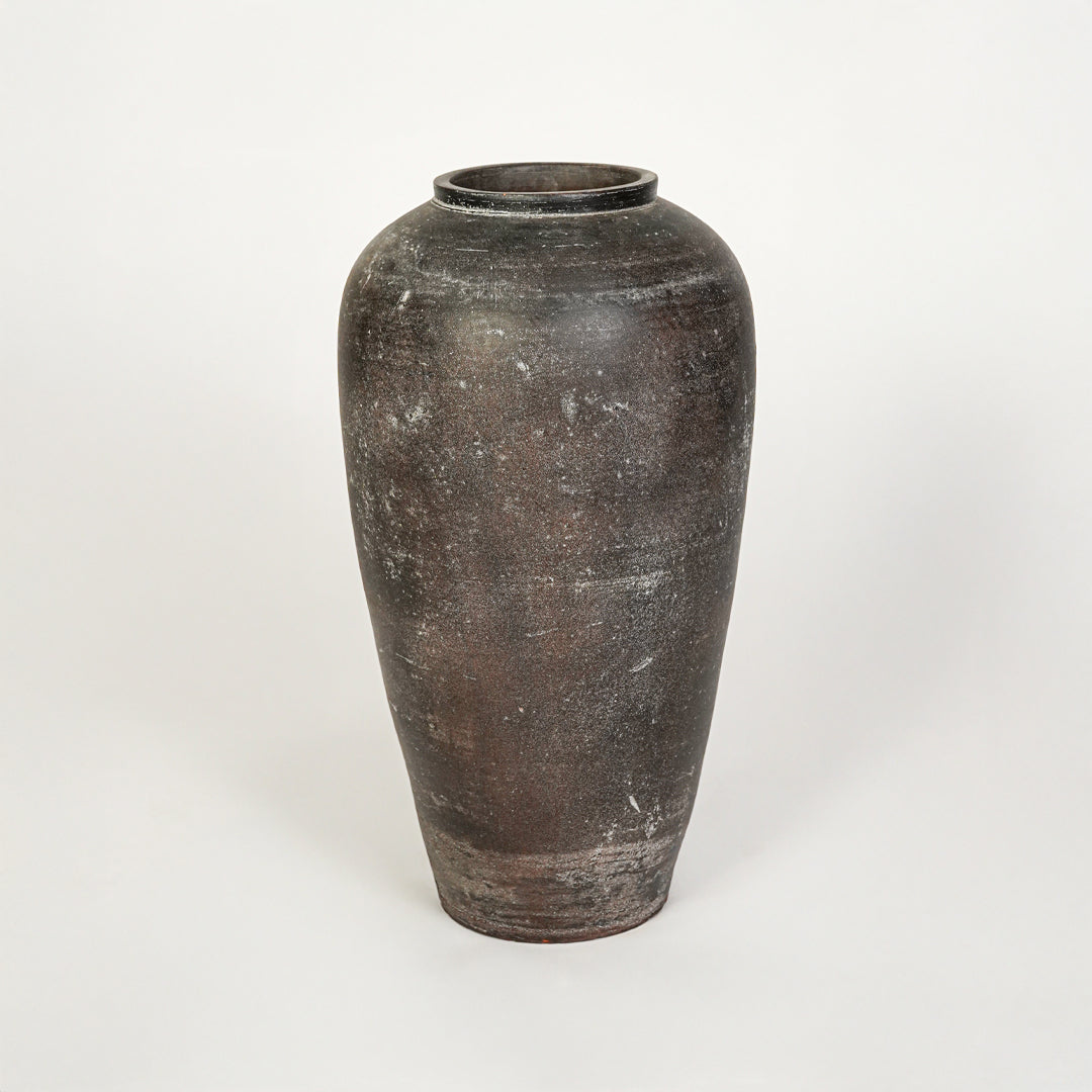 White background image of grey ceramic floor vase for elegant interior decor styling with rustic textured finish.