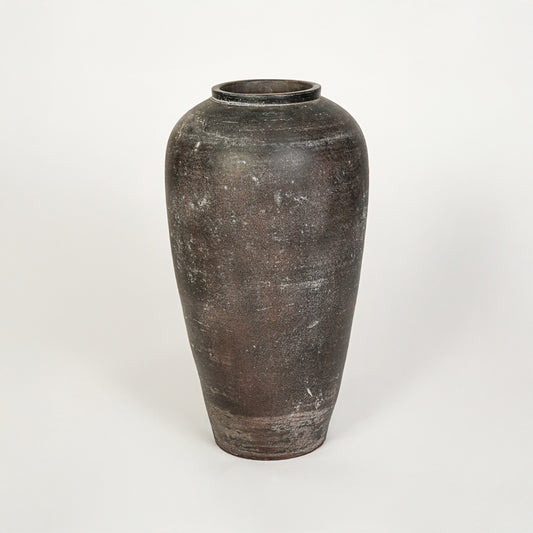 White background image of grey ceramic floor vase for elegant interior decor styling with rustic textured finish.