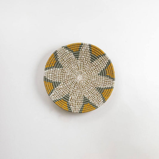 Handcrafted natural seagrass wall basket for living room hallway and boho décor on white background image.