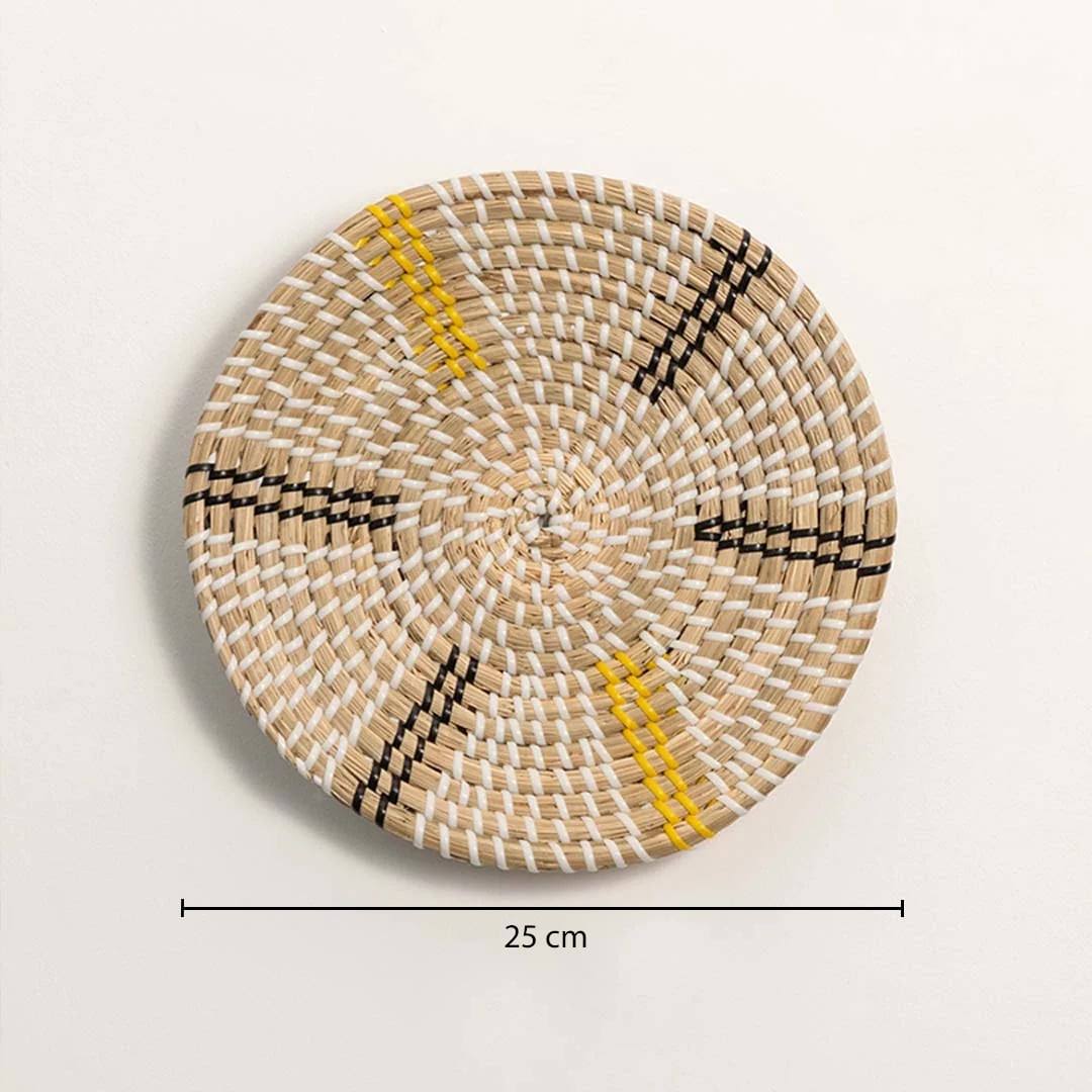 Dimension image of handcrafted natural cream seagrass wall basket with yellow and black striped spokes for boho wall decor.