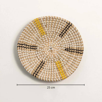 Dimension image of handcrafted natural cream seagrass wall basket with yellow and black striped spokes for boho wall decor.