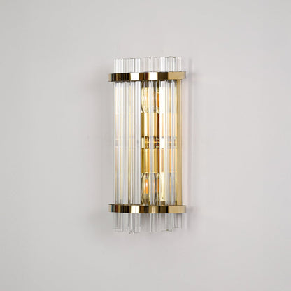 Elegant gold metal wall light switched off on dark background emphasizing sleek structure and premium glass detailing.