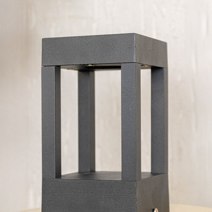 Detailed view highlighting sharp edges and smooth finish of elegant black metal outdoor pillar light.