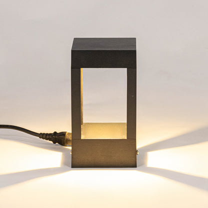 Modern black outdoor wall light with warm glowing panels for elegant exterior decor styling use.