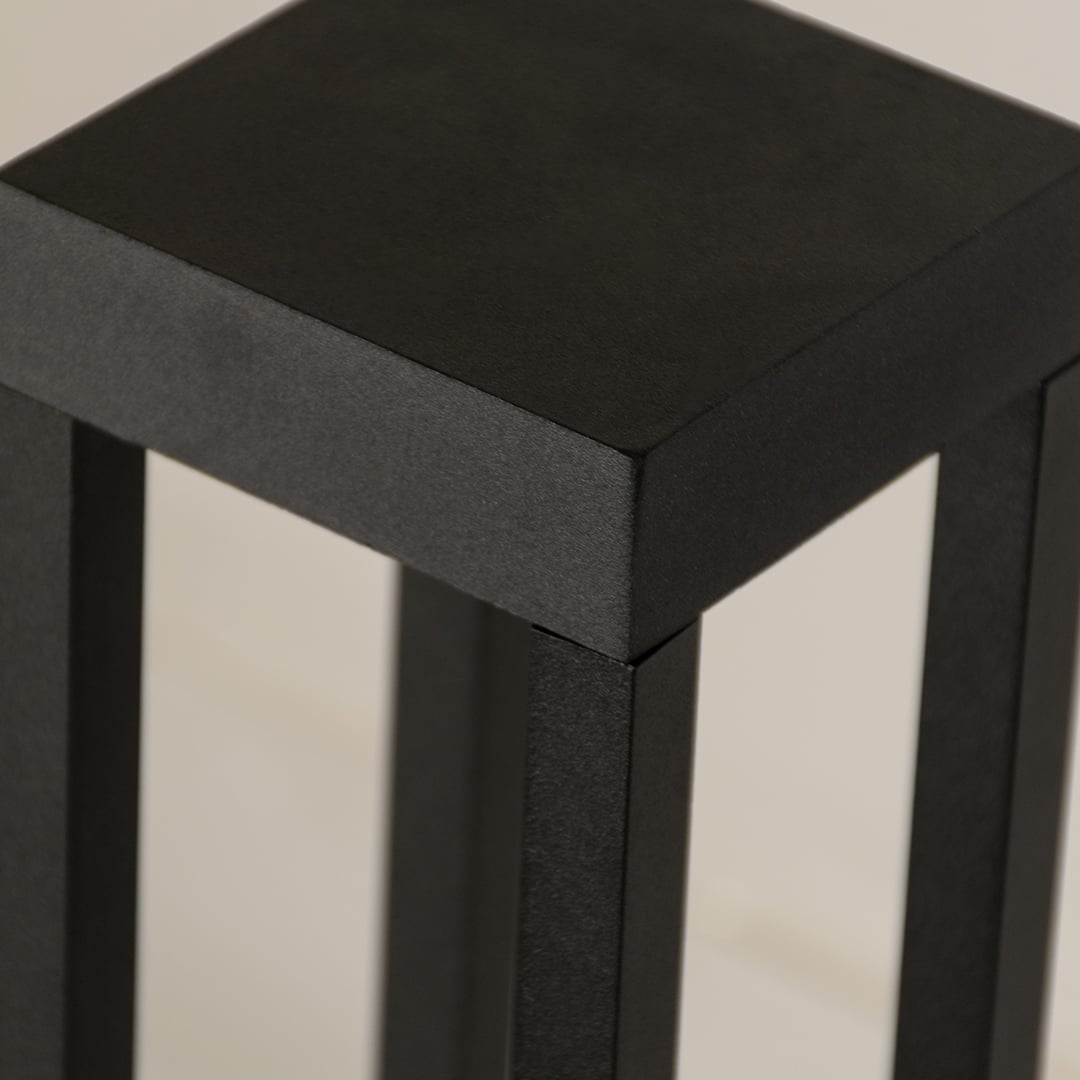 A detailed closeup highlighting the internal light source housing of the bollard light showing the clean structure and refined lines for a modern outdoor aesthetic.