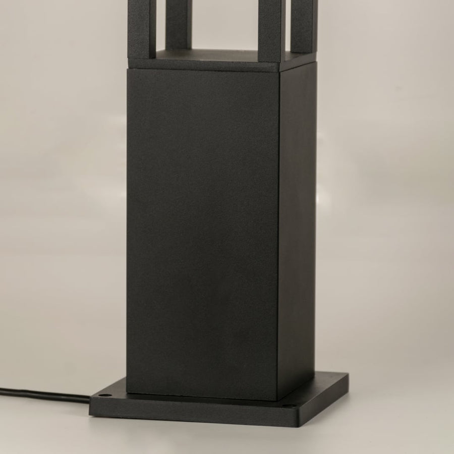 A closeup of the lower base of the bollard light showcasing the sturdy metal construction and smooth matte finish designed for durability in exterior environments.