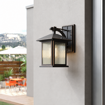 Modern black aluminum rectangular frosted glass wall lantern on white stucco facade for outdoor house patio lighting.
