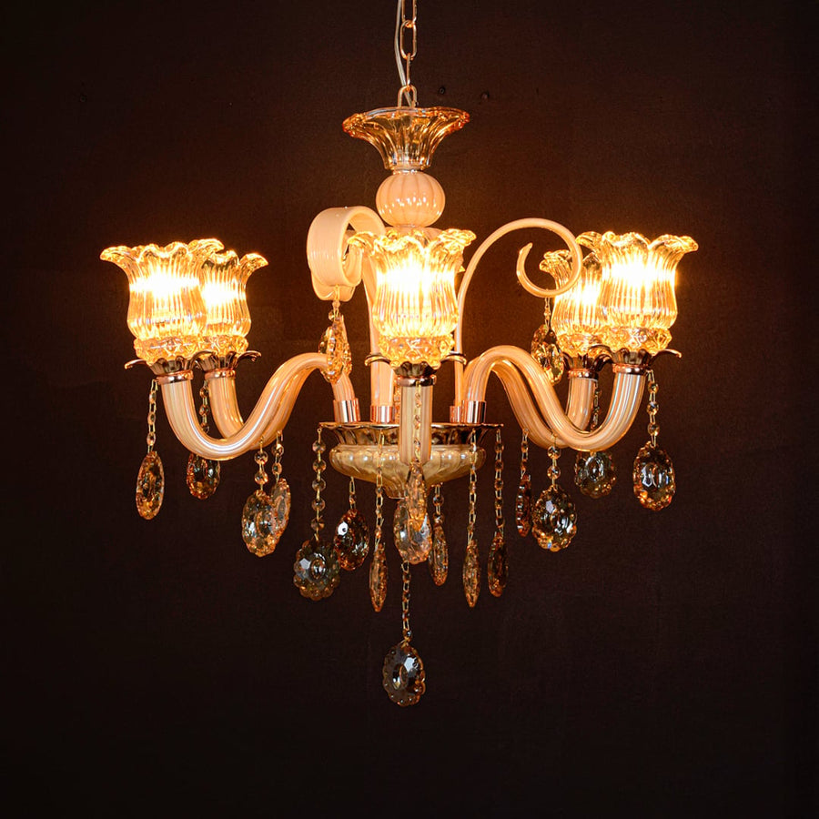 Golden glass crystal chandelier glowing warmly on black background creating a luxurious statement for modern ceilings.